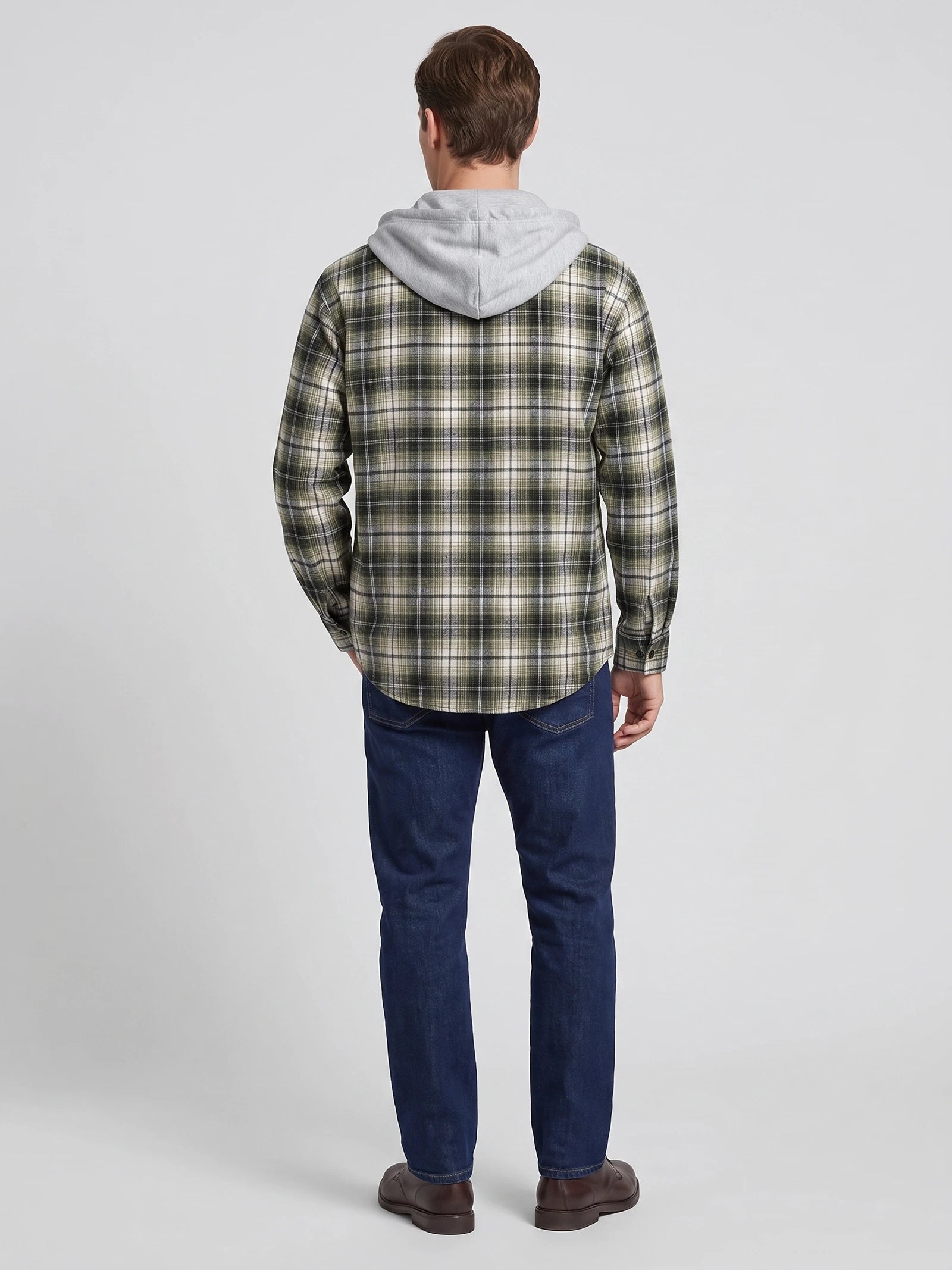 Rear studio view of a model wearing a Green plaid Flannel Jacket with a hood and long sleeves.