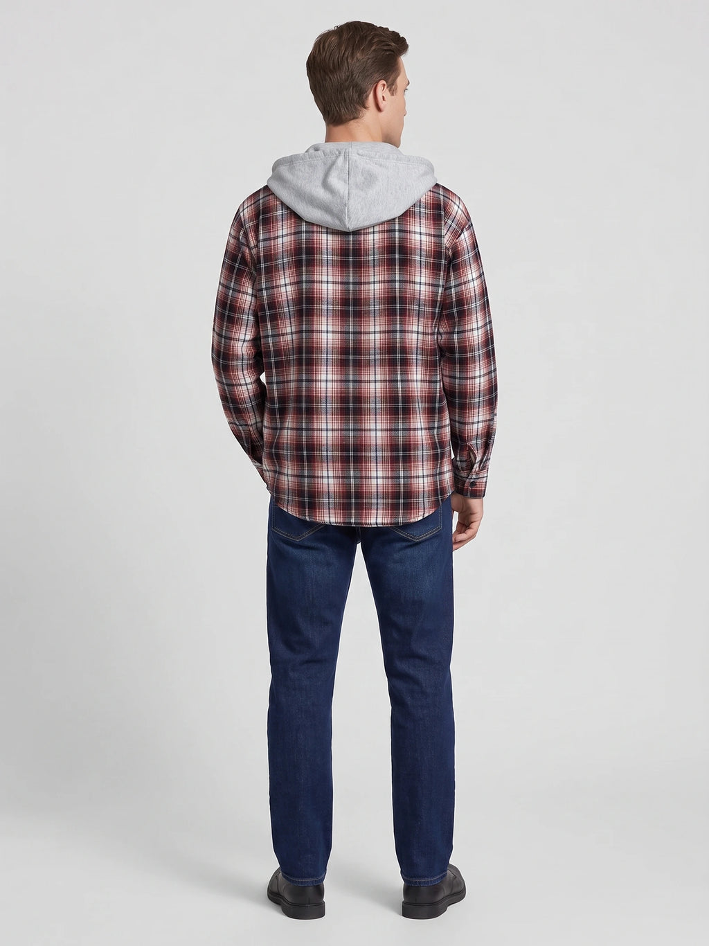 Rear studio view of a model wearing a Red plaid Flannel Jacket with an attached hood.
