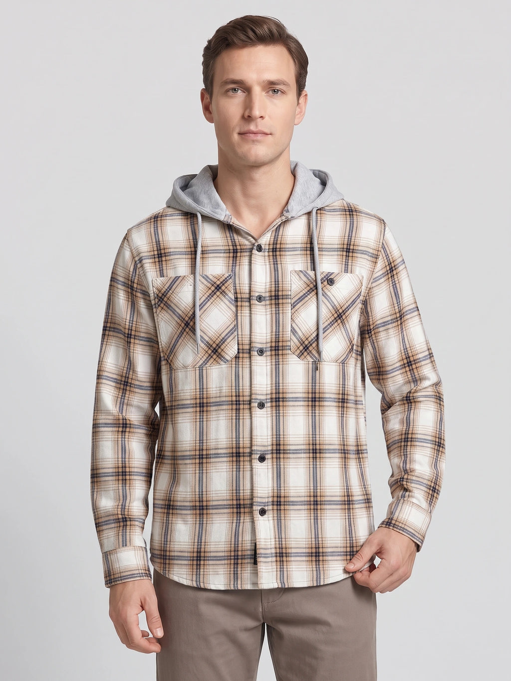 Front studio view of a model wearing a Yellow plaid Flannel Jacket with a drawstring hood, button front, and flap chest pockets.