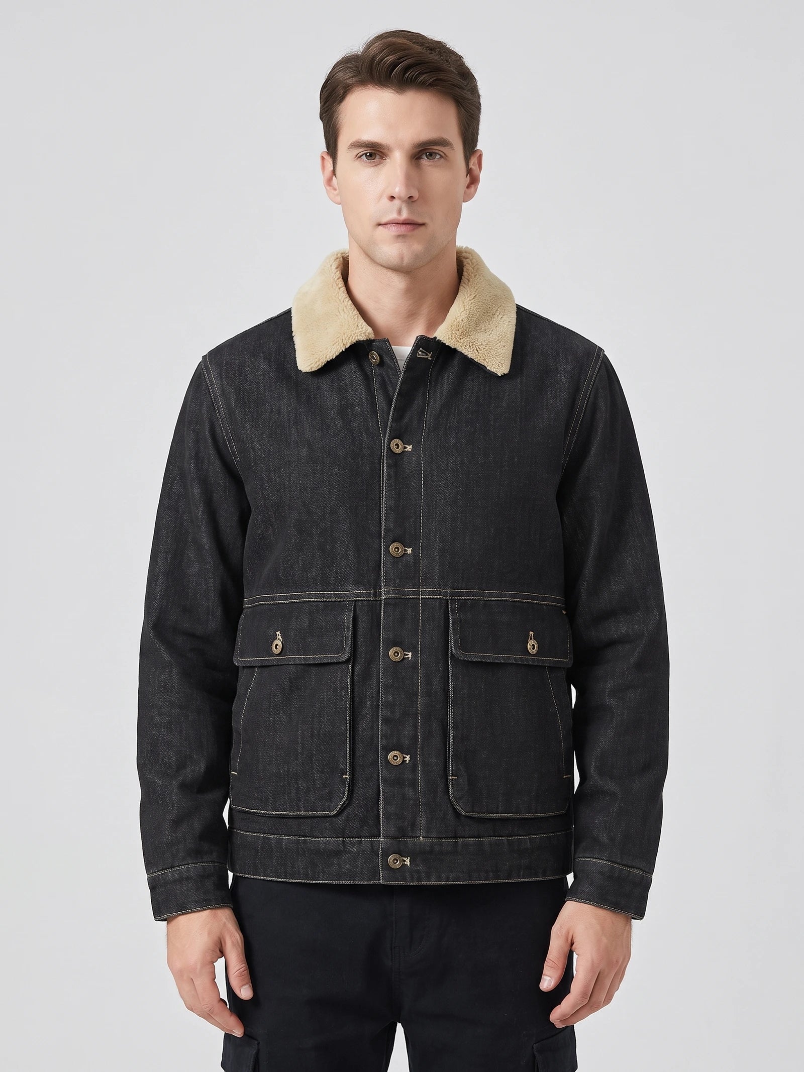 Front studio view of a model wearing a Black fleece jacket with a soft collar, button front, and large flap pockets.