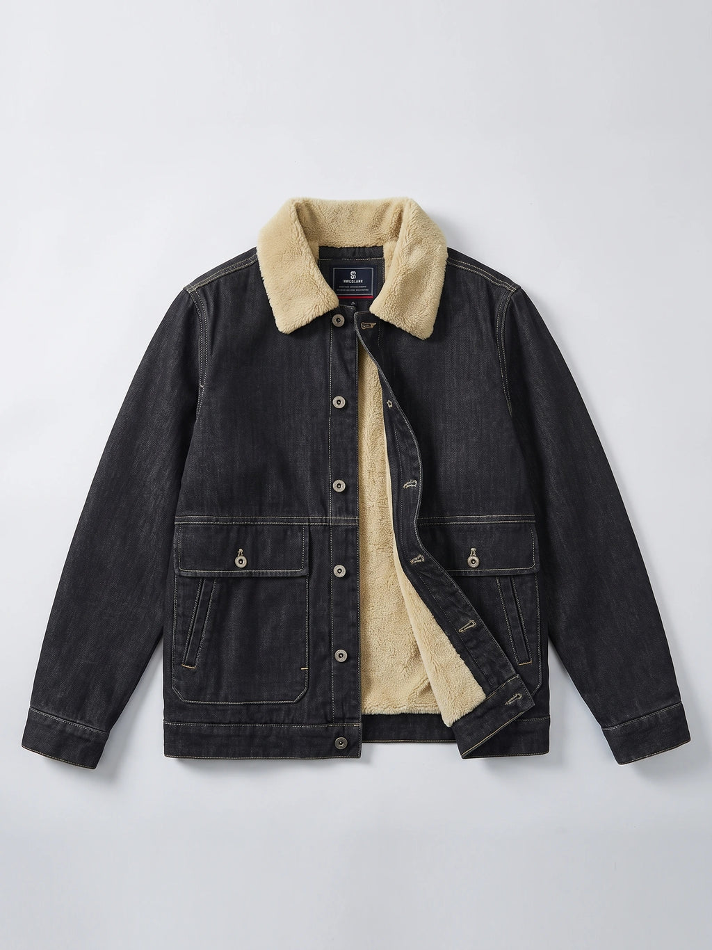 Black fleece jacket laid flat with a button front, flap cargo pockets, and exposed fleece lining at the collar and opening.
