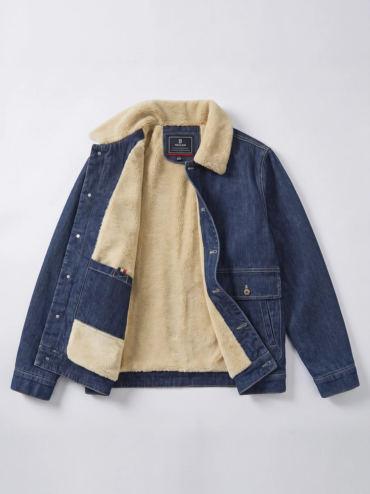 Blue fleece jacket laid flat with an open front showing its plush lining, snap closure, and flap pockets.