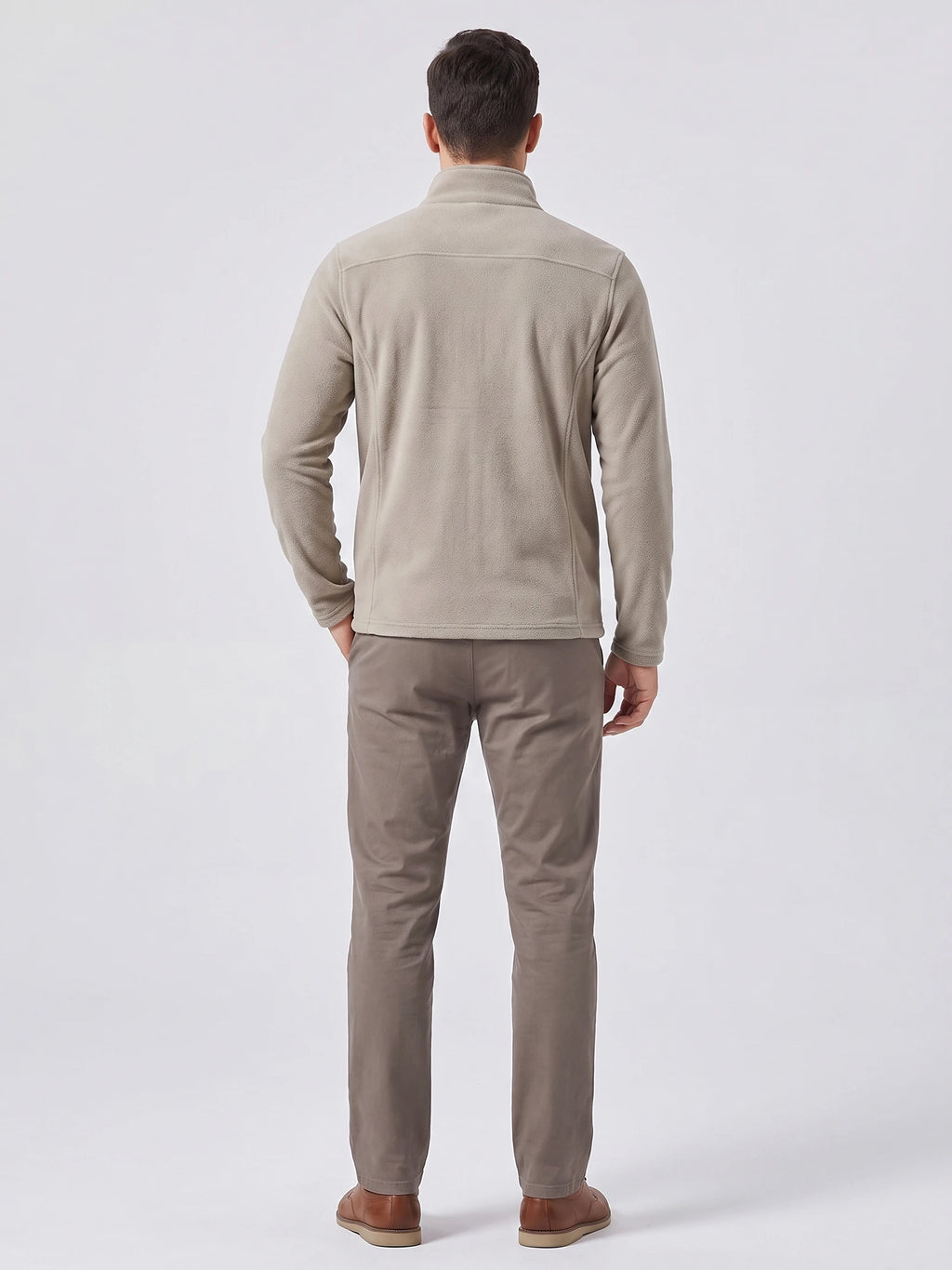 Rear studio view of a model wearing a Beige men's fleece jacket with a stand collar and back seam detailing.