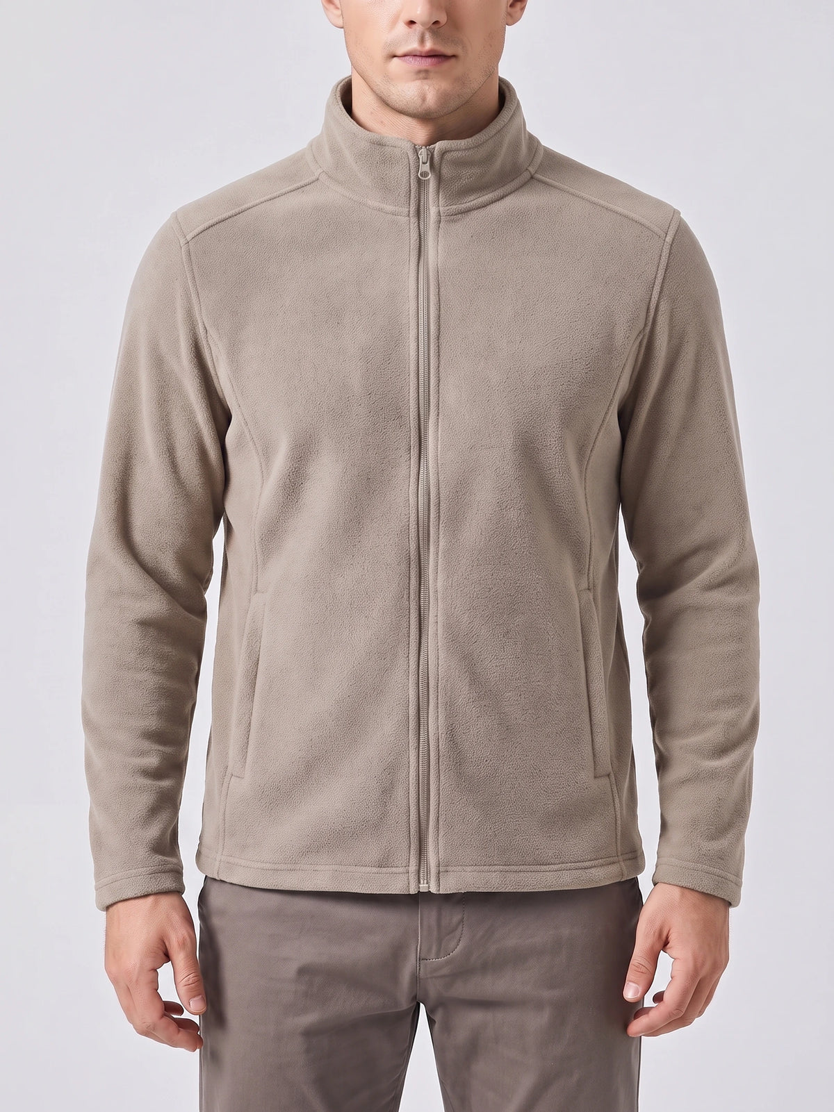 Front studio view of a model wearing a Beige men's Fleece Jacket with a full zip, stand collar, and side pockets.