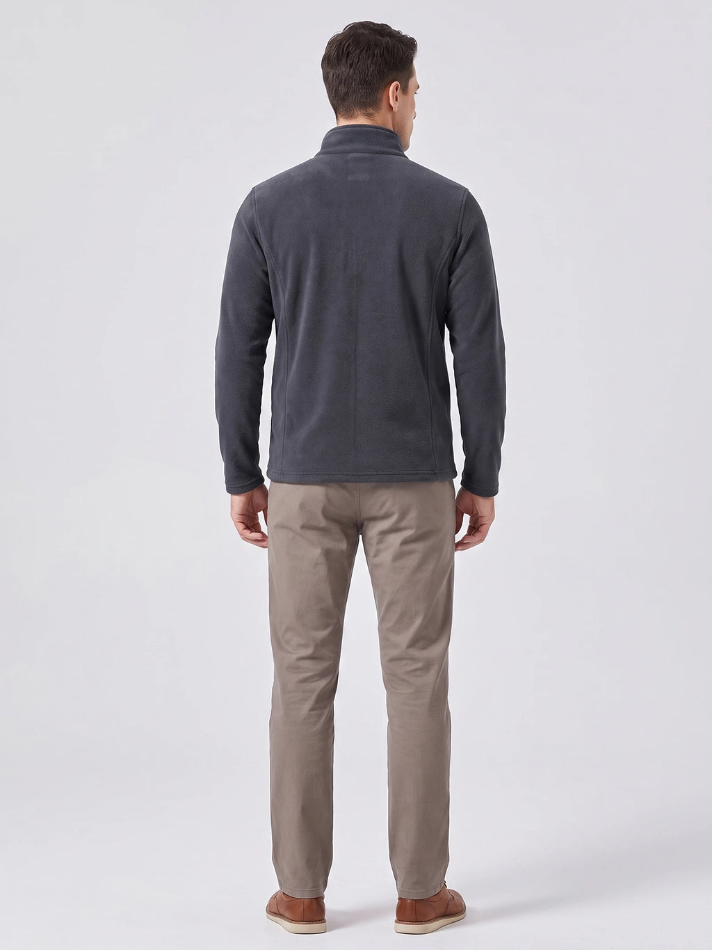 Rear studio view of a model wearing a Gray men's fleece jacket with a stand collar and long sleeves.