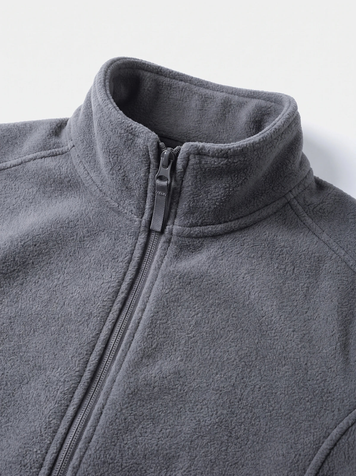 Close-up of the Gray men's Fleece Jacket showing its soft textured fabric, stand collar, and full front zipper.