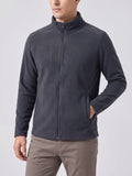 Front studio view of a model wearing a Gray men's Fleece Jacket with a full zip, stand collar, and hand pockets.
