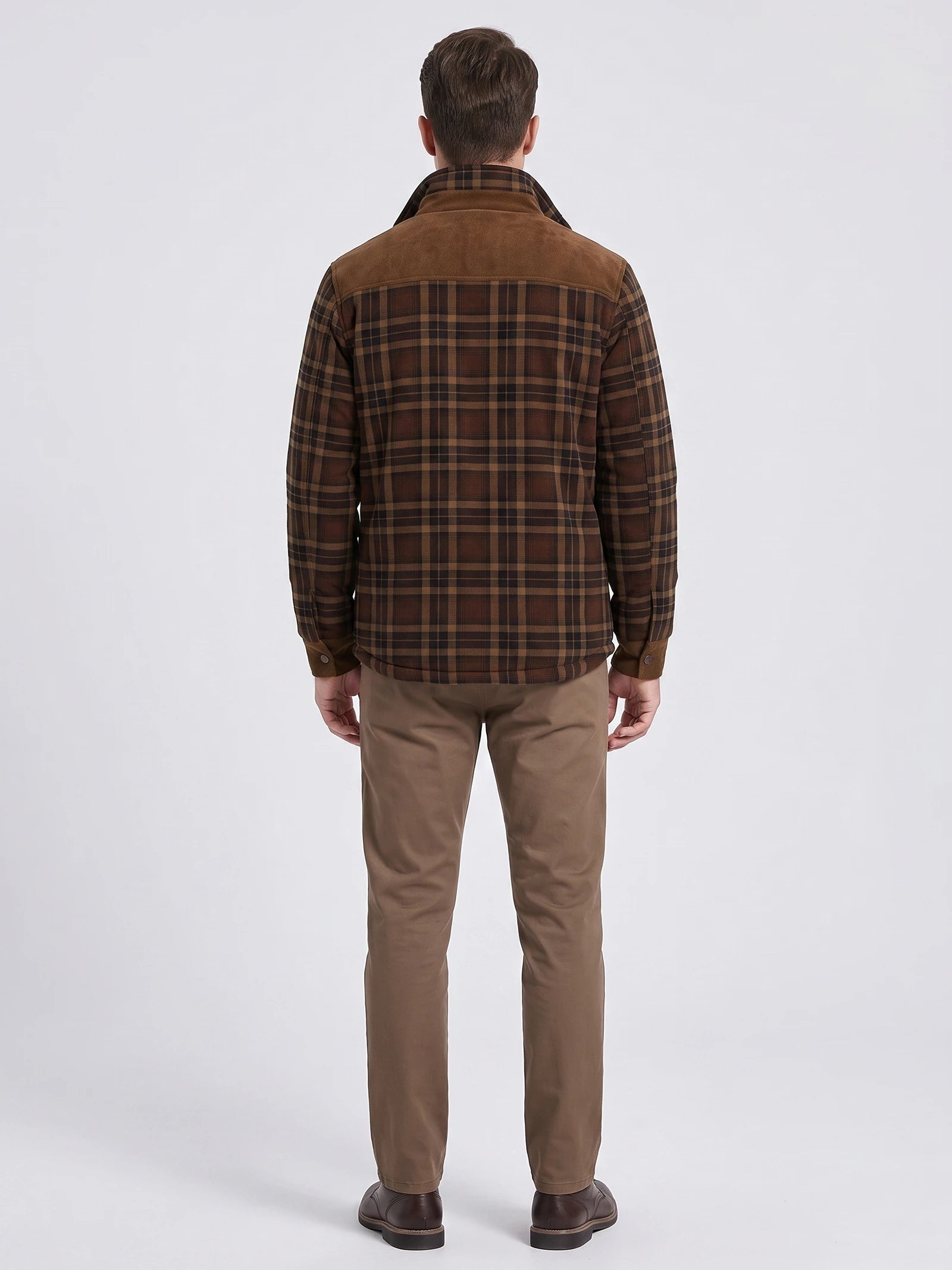Rear studio view of a model wearing a Brown fleece lined plaid shirt jacket with a contrasting shoulder yoke.