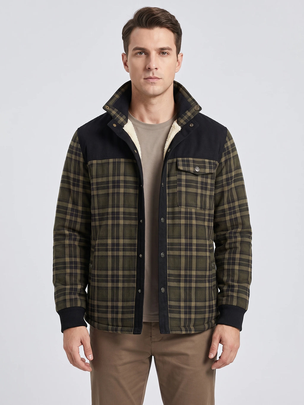 Front studio view of a model wearing a Green fleece-lined plaid shirt jacket with snap buttons, chest pockets, and ribbed cuffs.
