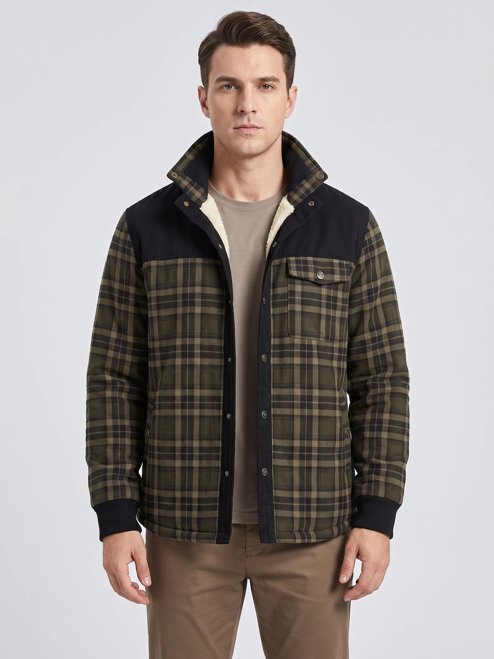 Front studio view of a model wearing a Green fleece-lined plaid shirt jacket with snap buttons, chest pockets, and ribbed cuffs.
