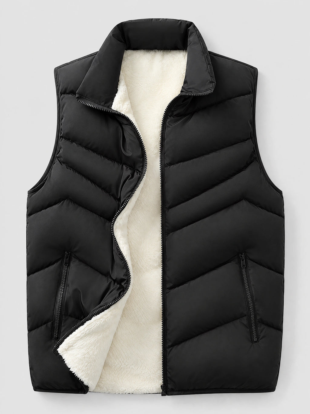 Black fleece lined puffer vest laid flat with an open front zipper, stand collar, quilted panels, and zippered pockets.