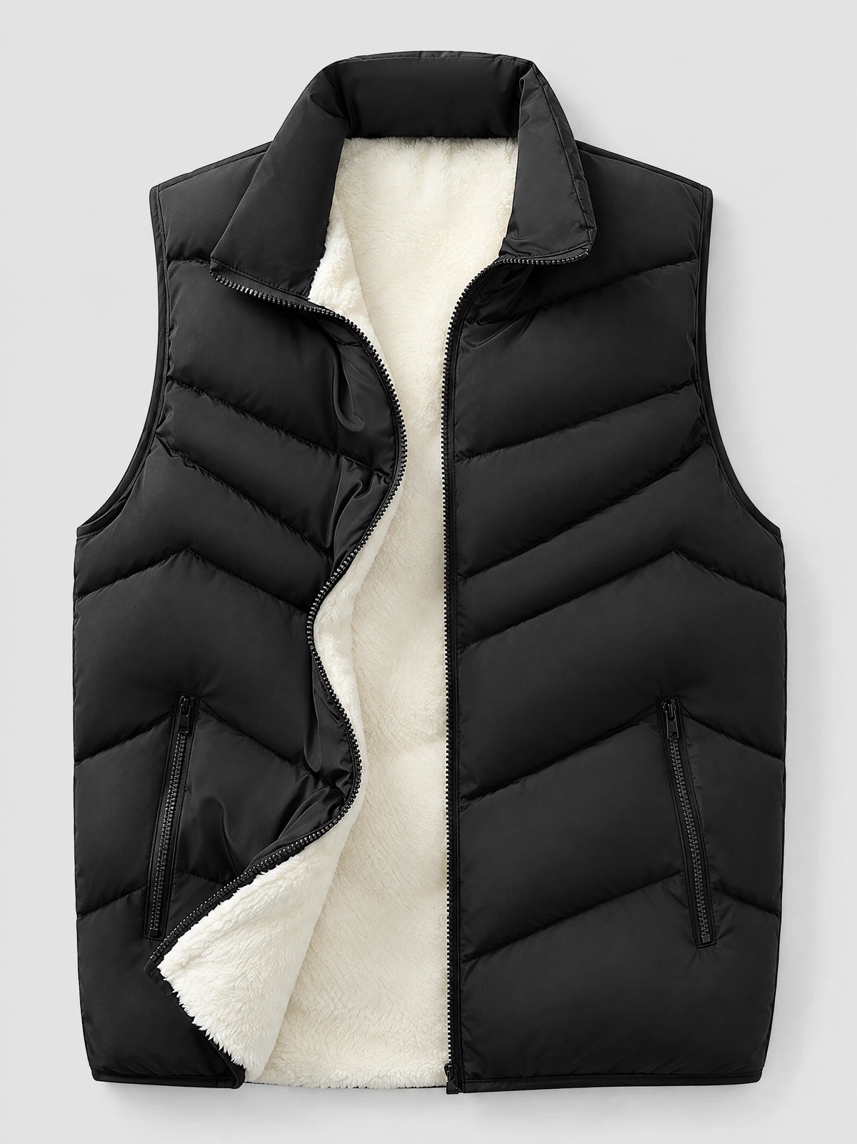 Black fleece lined puffer vest laid flat with an open front zipper, stand collar, quilted panels, and zippered pockets.