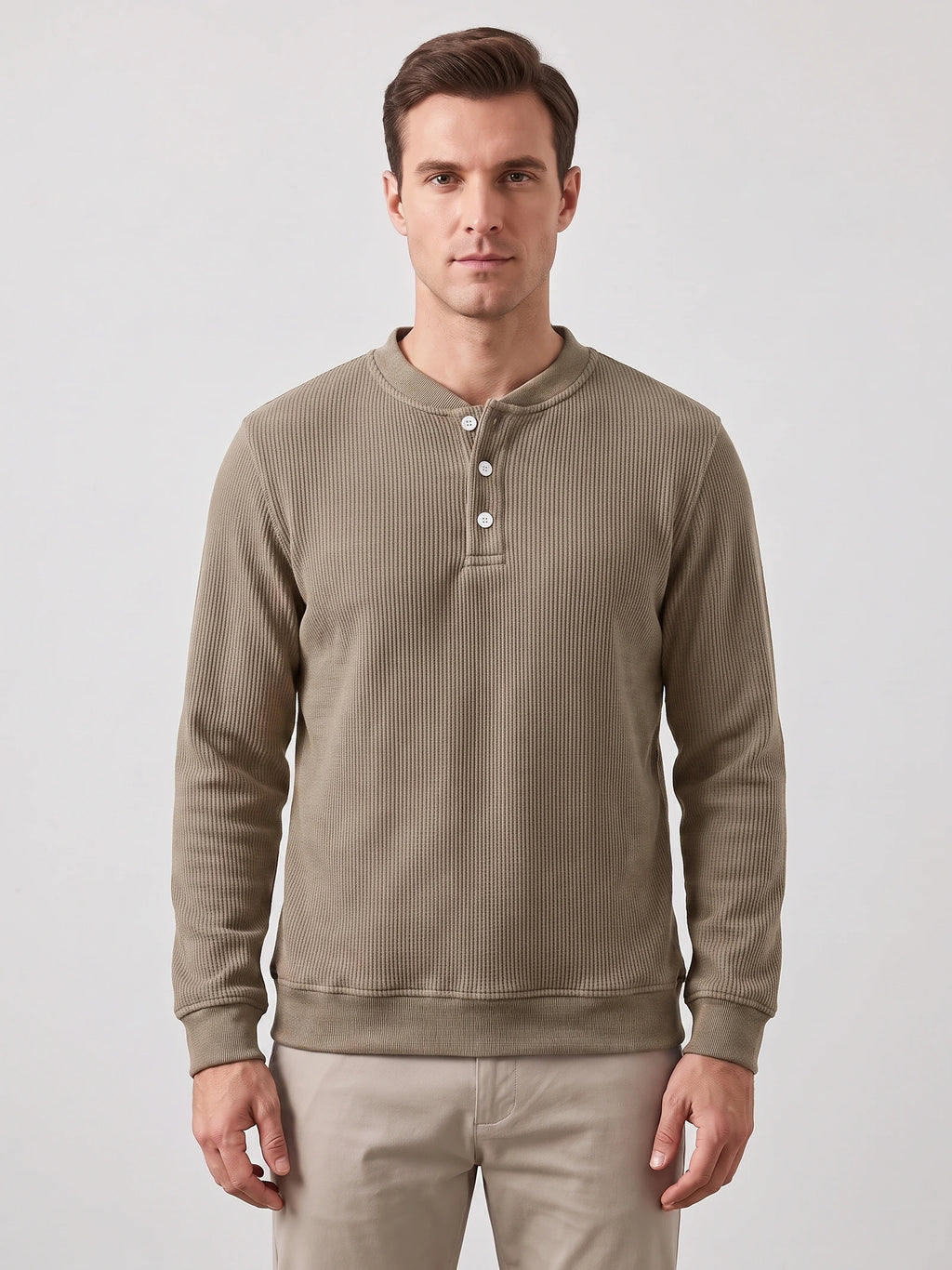 Front studio view of a model wearing a Khaki fleece lined sweater with ribbed texture, long sleeves, and a three-button Henley placket.
