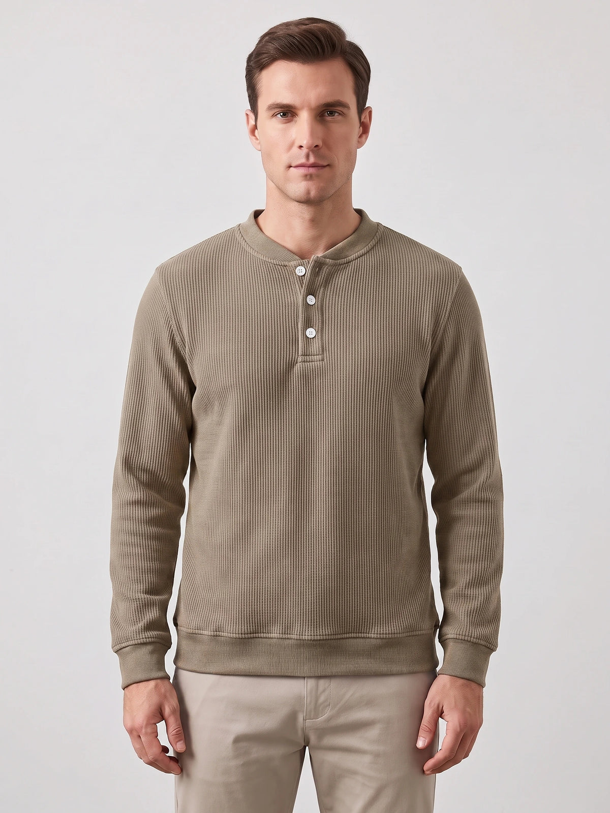 Front studio view of a model wearing a Khaki fleece lined sweater with ribbed texture, long sleeves, and a three-button Henley placket.
