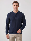 Front studio view of a model wearing a Navy fleece lined sweater with ribbed texture, long sleeves, and a three-button Henley placket.