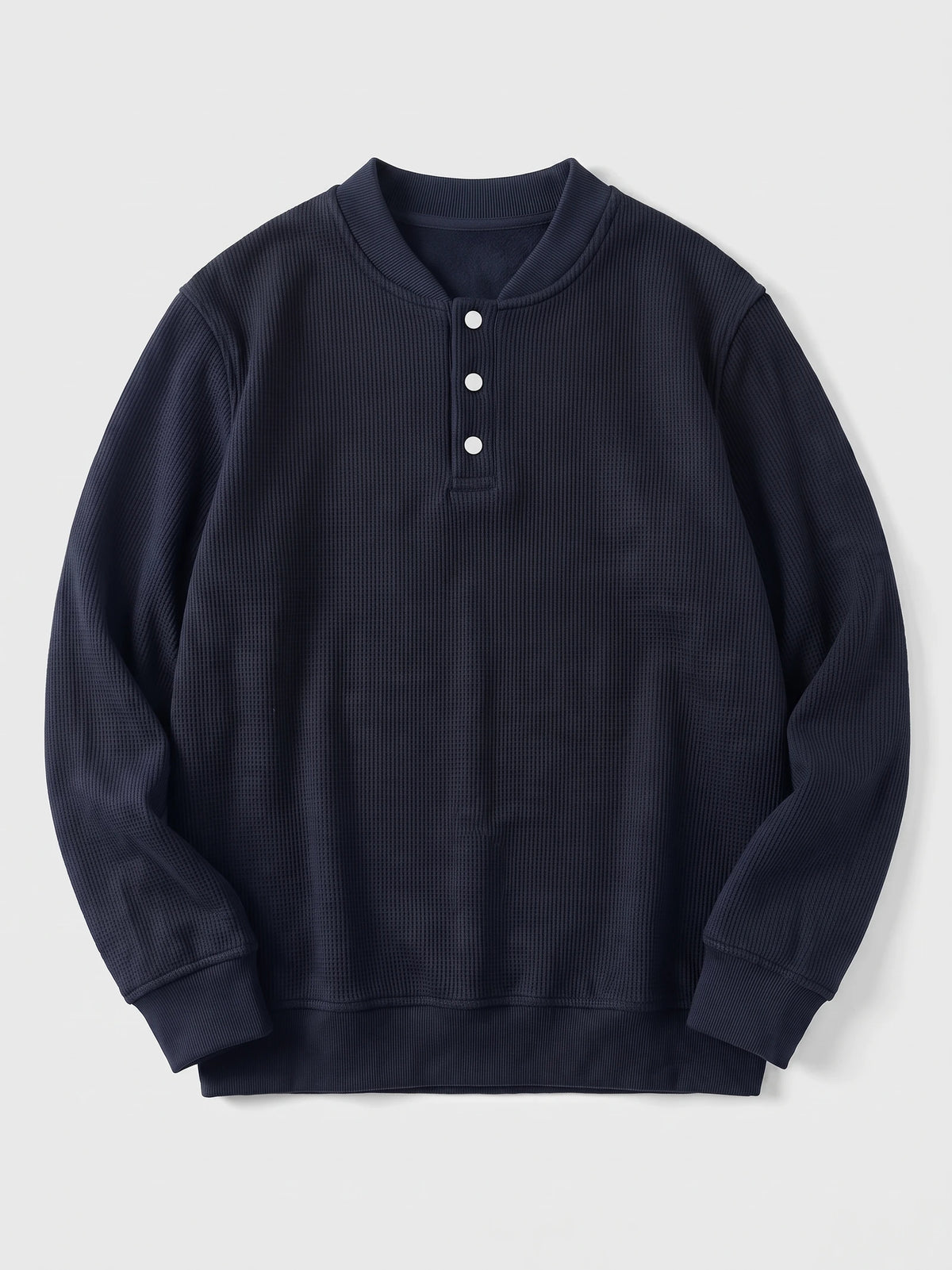 Navy fleece lined sweater laid flat, featuring a ribbed collar, three-button Henley placket, and long sleeves.