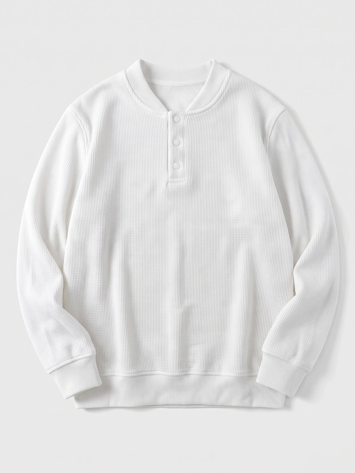 White fleece lined sweater laid flat, featuring a ribbed texture, three-button Henley placket, and long sleeves.