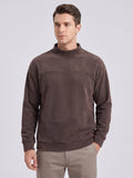 Front studio view of a model wearing a Brown men's Fleece Sweater with a mock neck and angled front pocket.