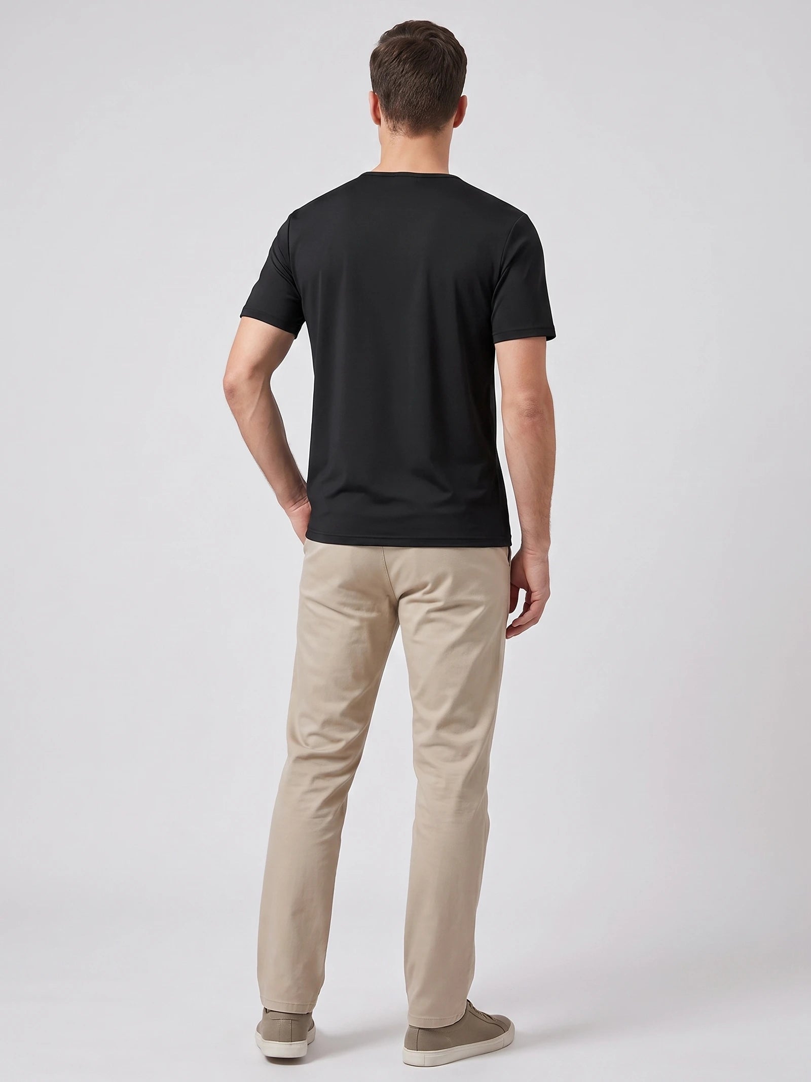 Rear studio view of a model wearing a Black short-sleeve Henley T-shirt.