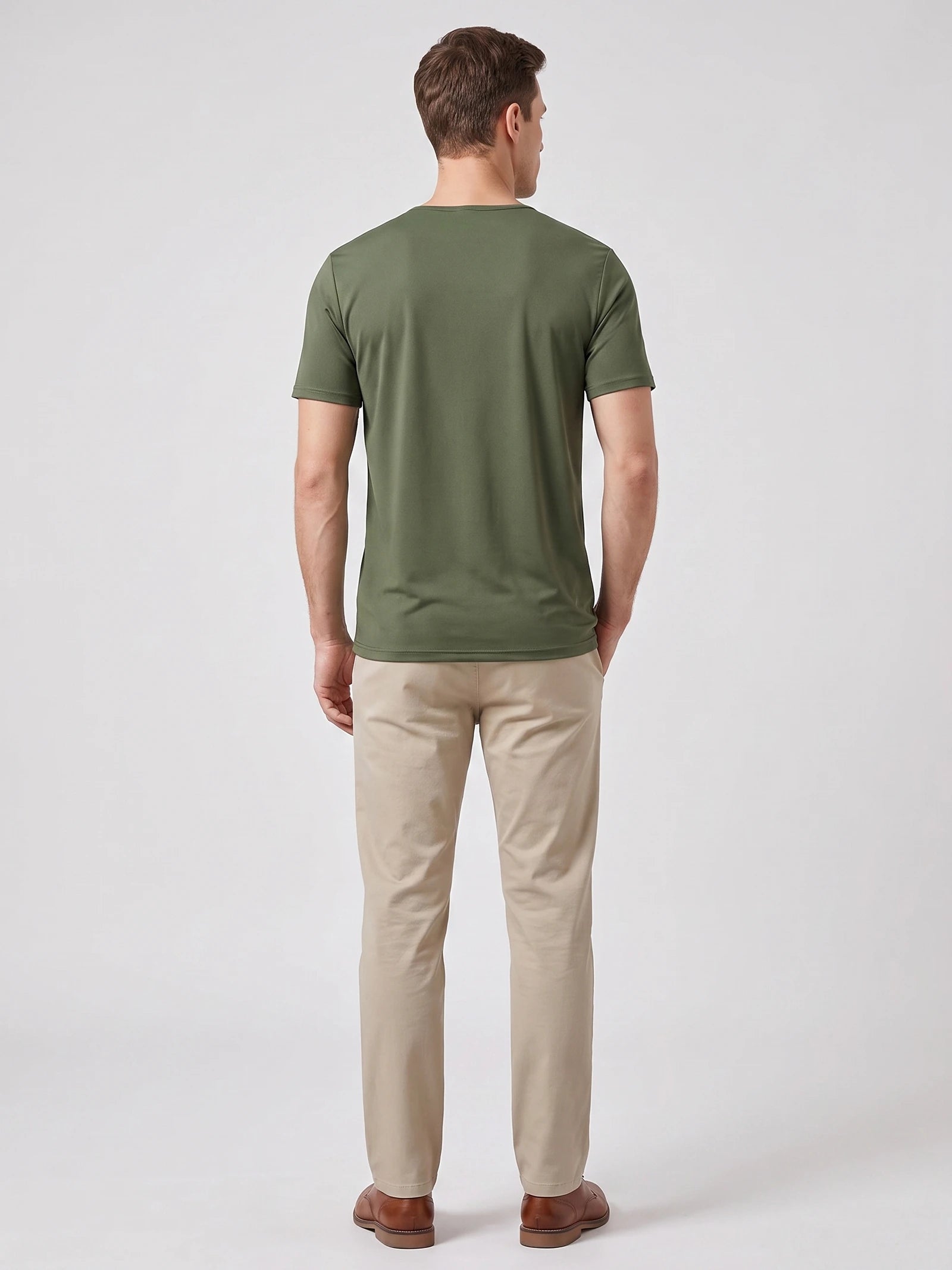 Rear studio view of a model wearing a Green short-sleeve Henley T-shirt.
