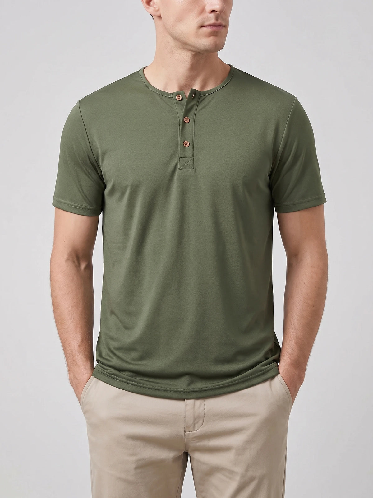 Front studio view of a model wearing a Green short-sleeve Henley T-shirt with a three-button collar.