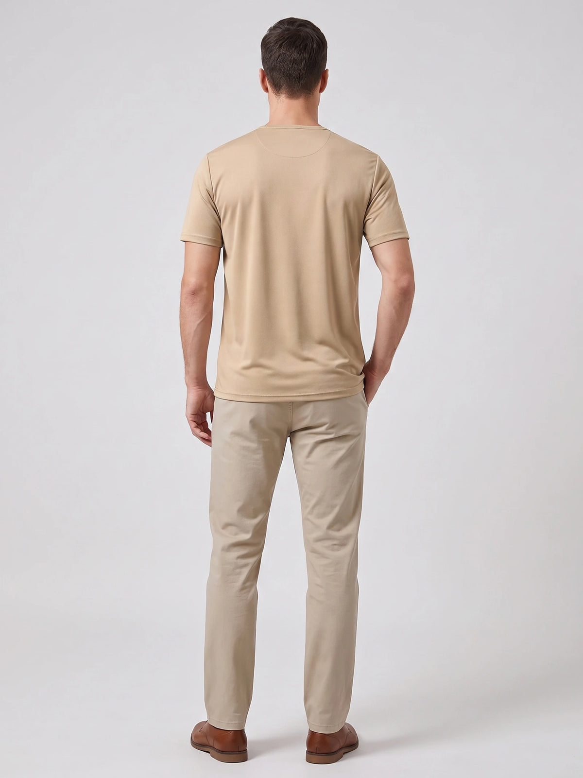 Rear studio view of a model wearing a Khaki short-sleeve Henley T-shirt.