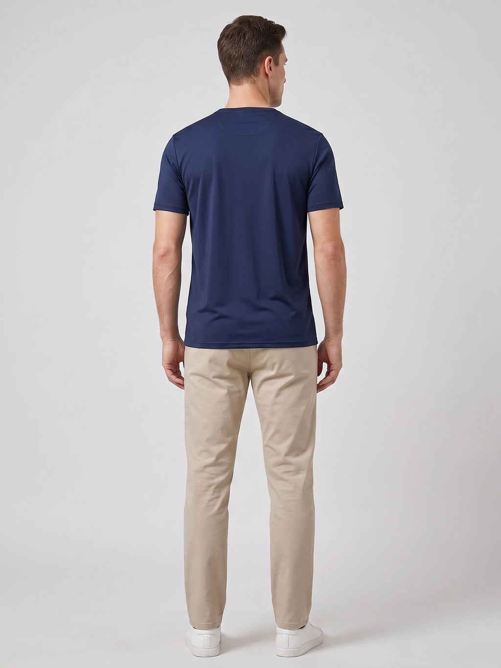 Rear studio view of a model wearing a Navy short-sleeve Henley T-shirt.