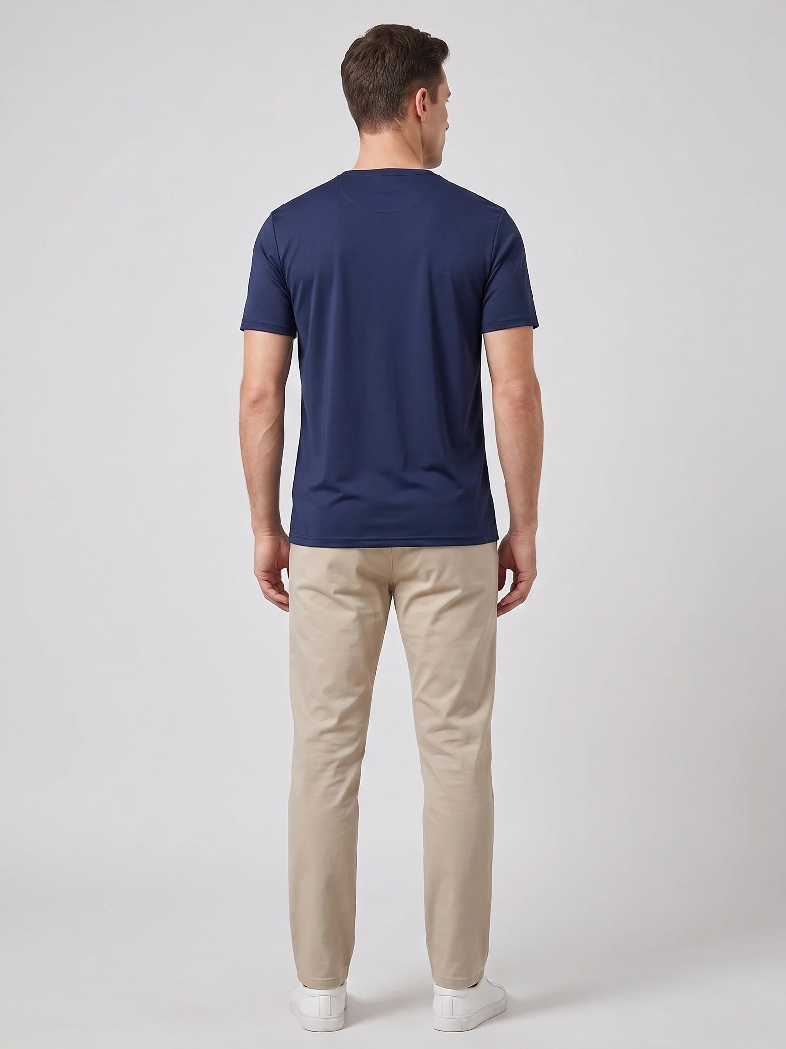 Rear studio view of a model wearing a Navy short-sleeve Henley T-shirt.