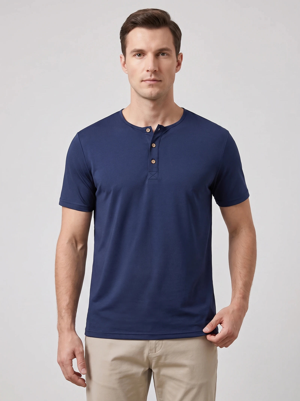 Front studio view of a model wearing a Navy Henley T-shirt with short sleeves and a three-button collar.