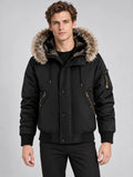 Front studio view of a model wearing a Black Hooded Fur Collar Jacket with zip pockets and a button-front placket.