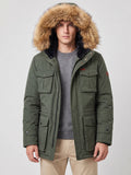 Front studio view of a model wearing a Green men's parka with a fur-trimmed hood and flap pockets.