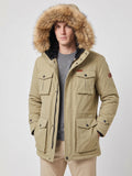 Front studio view of a model wearing a Khaki men's parka with a fur-trimmed hood and flap pockets.