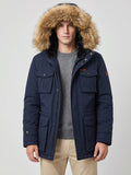 Front studio view of a model wearing a Navy men's parka with a fur-trimmed hood and flap pockets.