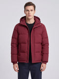 Front studio view of a model wearing a Wine Hooded Puffer Jacket with a zip-and-snap front, quilted panels, and flap pockets.