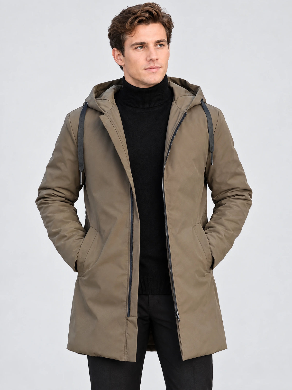 Front studio view of a model wearing a Brown men’s hooded trench coat with drawcord hood, zip closure, and hands in pockets.