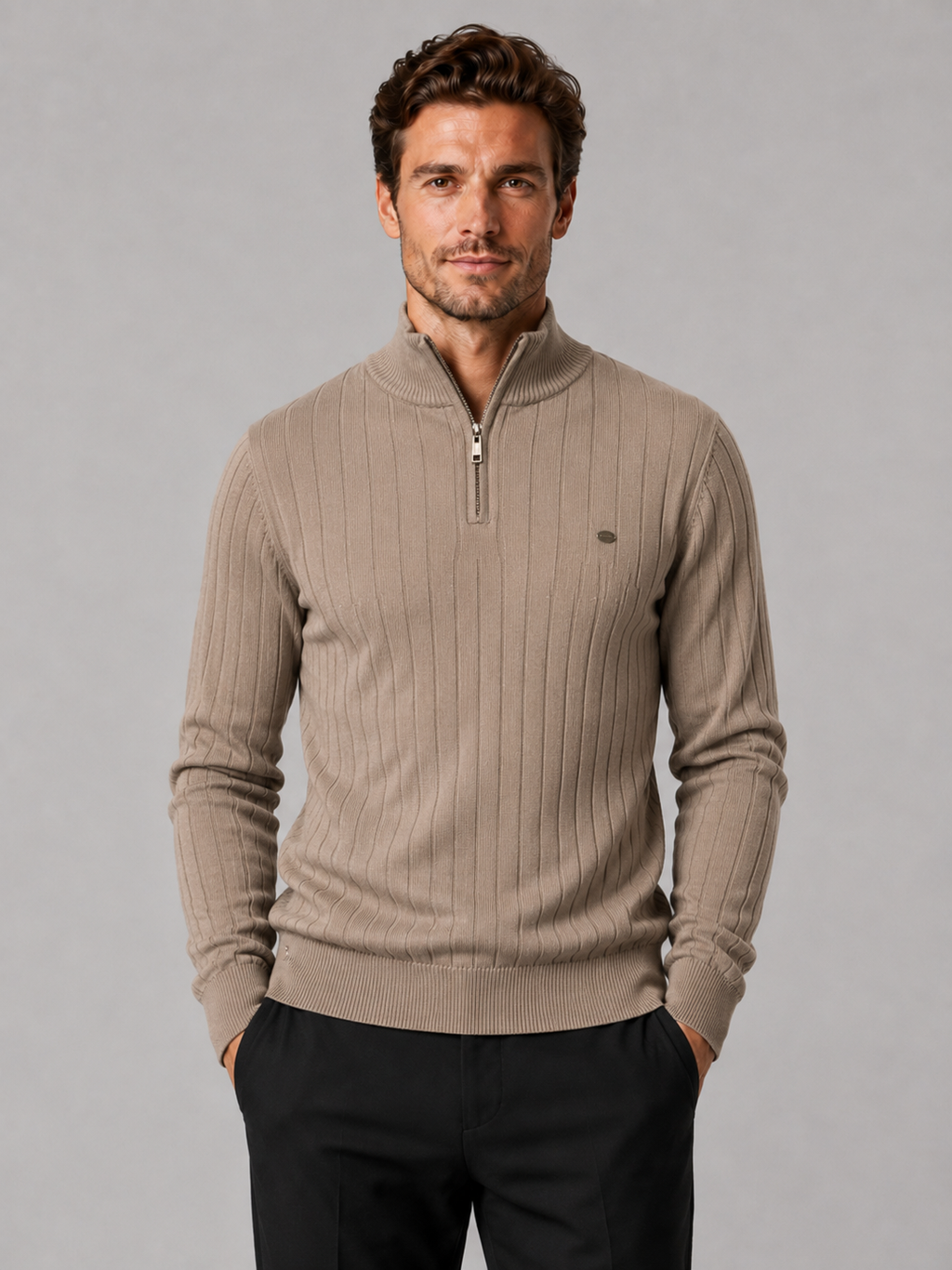 Front view of a man wearing a khaki quarter zip pullover sweater with a stand collar, warm cotton knit, and long sleeves