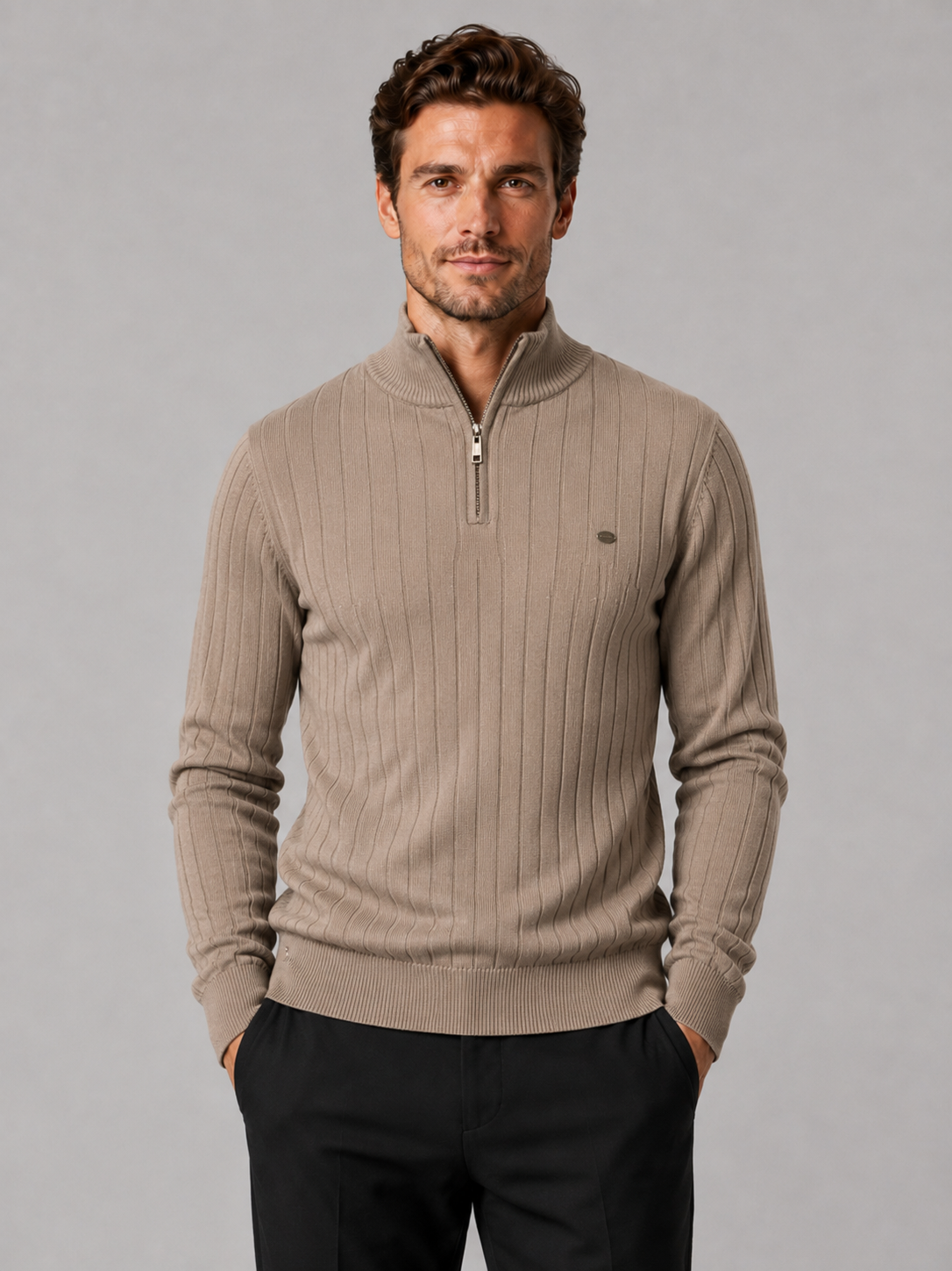 Front view of a man wearing a khaki quarter zip pullover sweater with a stand collar, warm cotton knit, and long sleeves