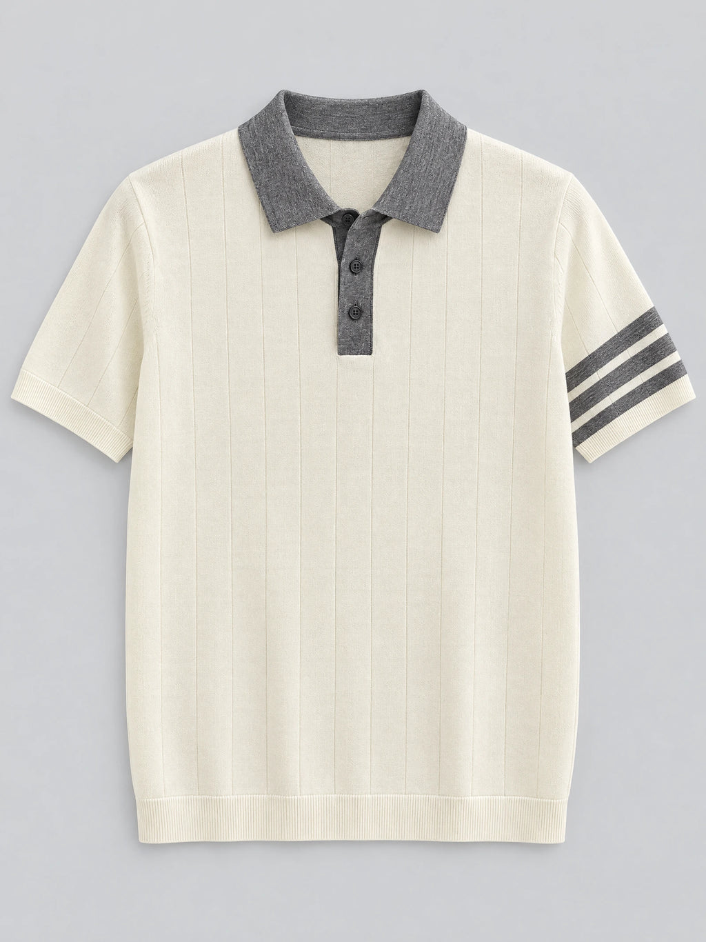 Beige knit polo shirt laid flat, featuring a contrast collar, three-button placket, vertical knit texture, and striped short-sleeve cuffs.