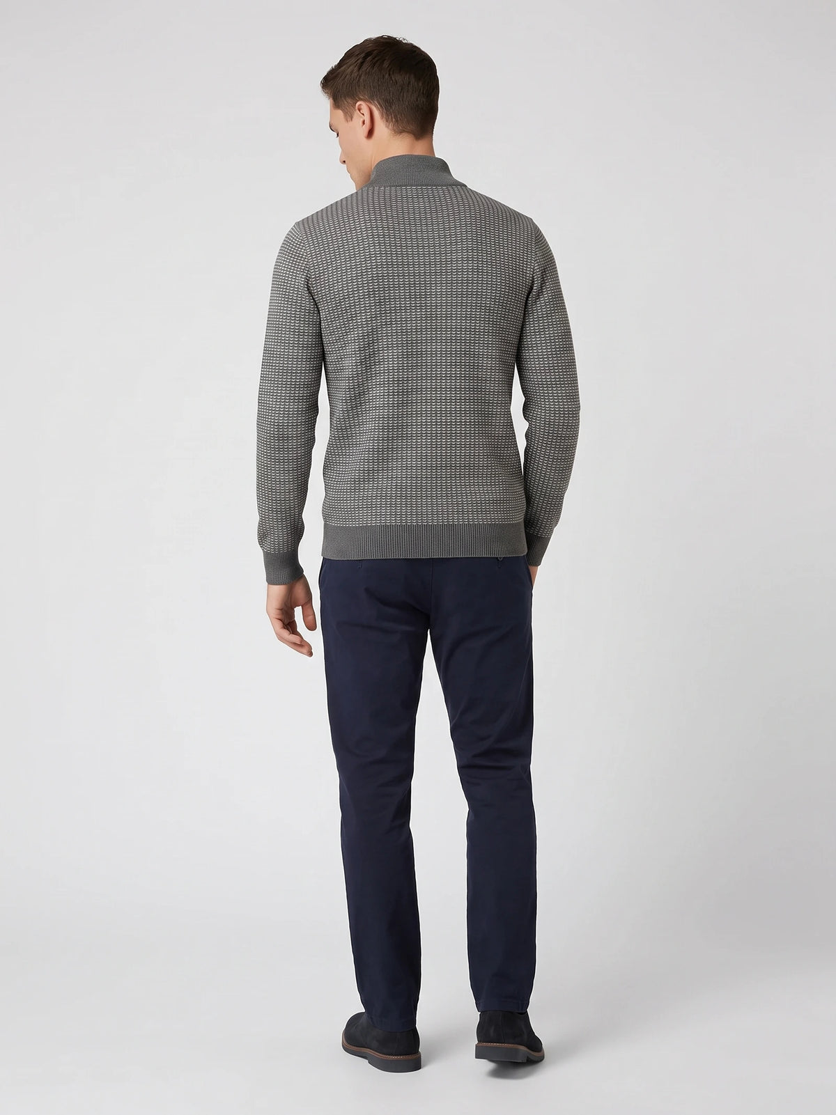 Rear studio view of a model wearing a Gray Knit Quarter Zip Sweater with textured knit and ribbed hem.