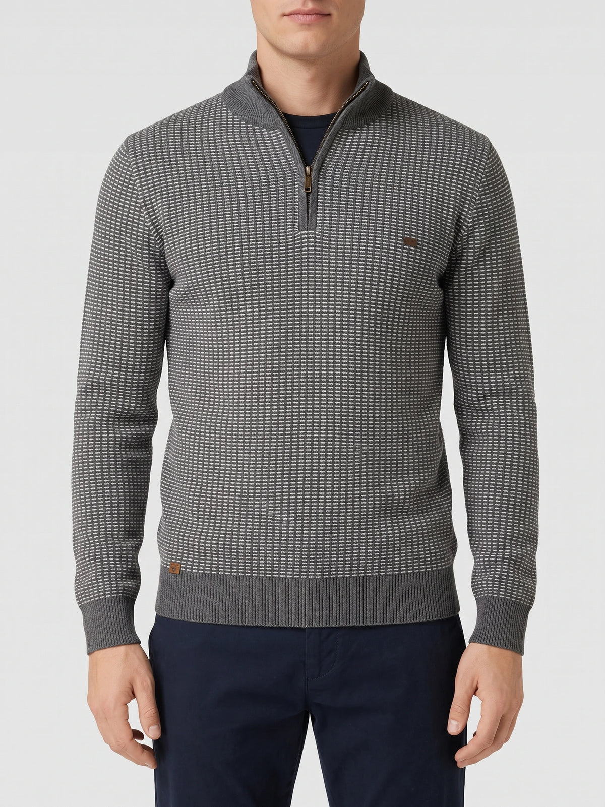 Front studio view of a model wearing a Gray knit quarter zip sweater with a textured striped pattern and ribbed mock neck.
