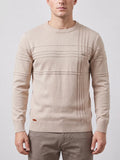 Front studio view of a model wearing a Beige knitted cotton crewneck sweater with textured stripe detailing and ribbed trim.