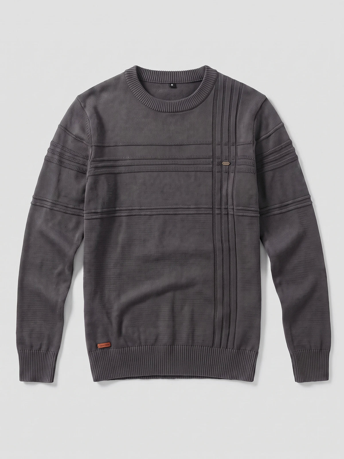 Charcoal knitted cotton crewneck sweater laid flat, featuring ribbed trim and textured stripe detailing across the chest and sleeves.