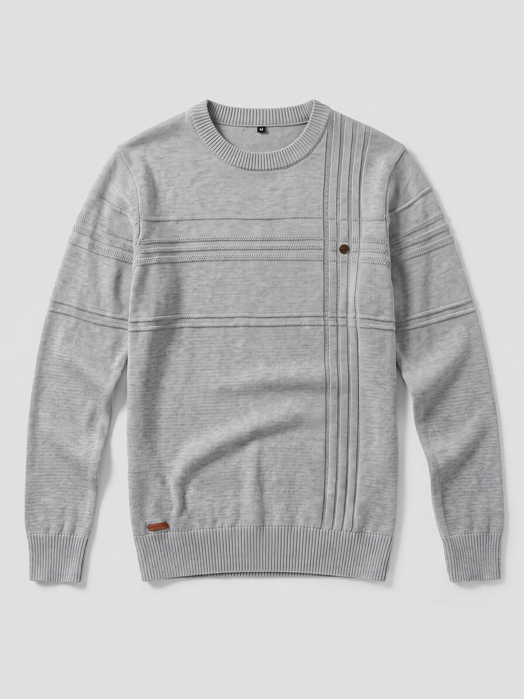 Gray knitted cotton crewneck sweater laid flat, featuring ribbed trim, textured horizontal bands, and a vertical knit panel with a button.