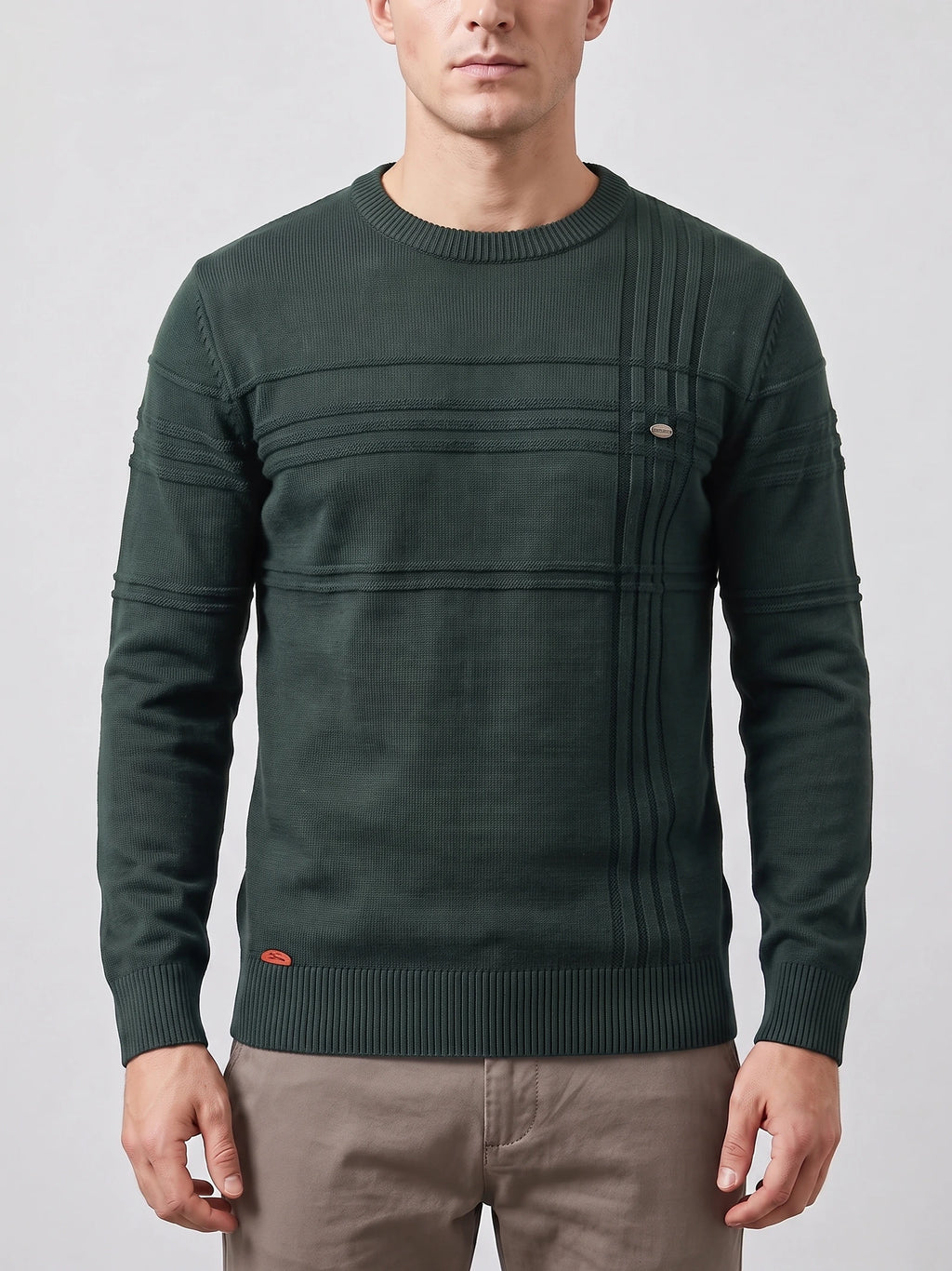 Front studio view of a model wearing a Green knitted cotton crewneck sweater with textured ribbed paneling.