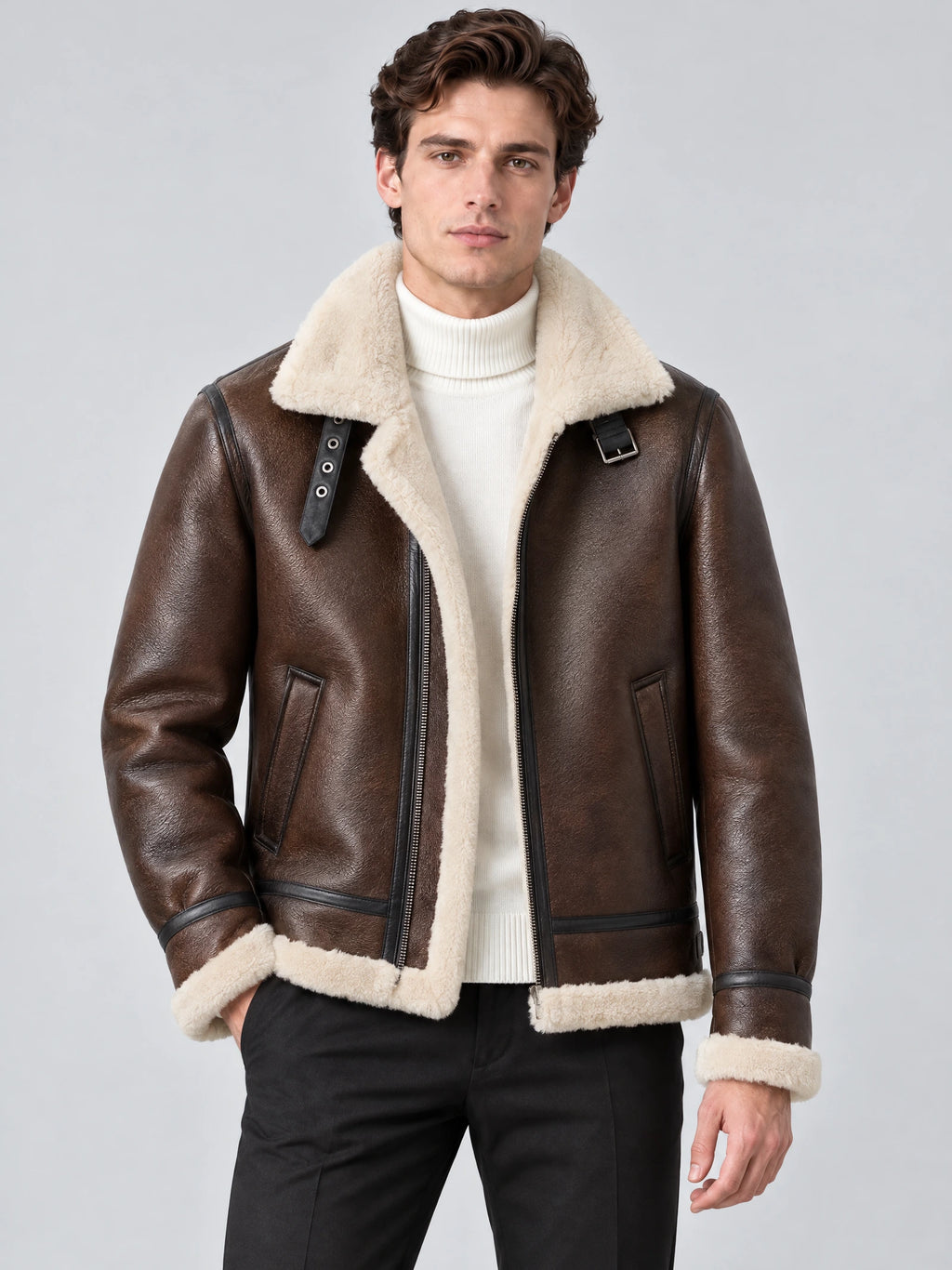 Front studio view of a model wearing a Brown Leather Aviator Jacket with shearling-style collar and trim, zip front, and angled pockets.