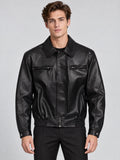Front studio view of a model wearing a Black leather bomber jacket with a lapel collar, zip chest pockets, and elasticated hem.