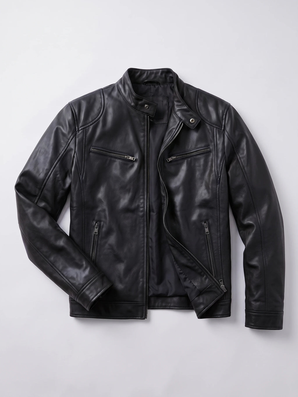 Black Men's Leather Jacket laid flat, showing an asymmetrical front zipper, snap-tab collar, and zippered chest and side pockets.