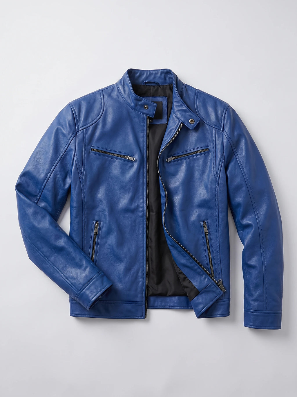 Blue men's leather jacket laid flat with an asymmetrical front zip, snap-tab collar, and multiple zip pockets.