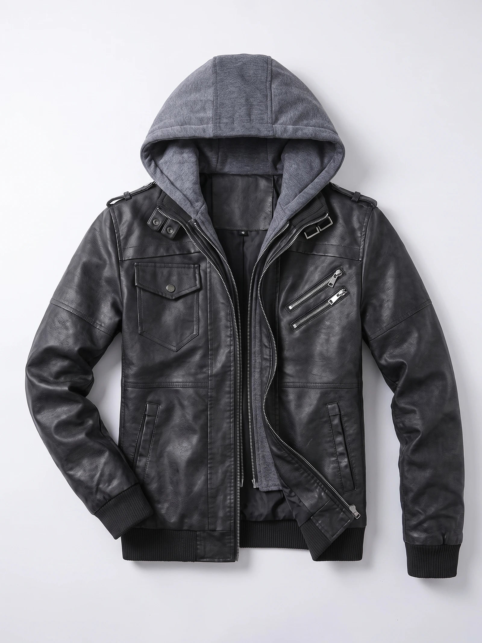 Black mens leather jacket laid flat, featuring an attached hood, asymmetric zipper, flap chest pocket, and zippered pockets.