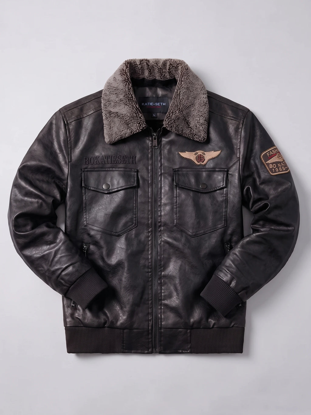 Black Leather Jacket laid flat, featuring a textured fur collar, front zipper, flap chest pockets, ribbed trim, and embroidered patches.
